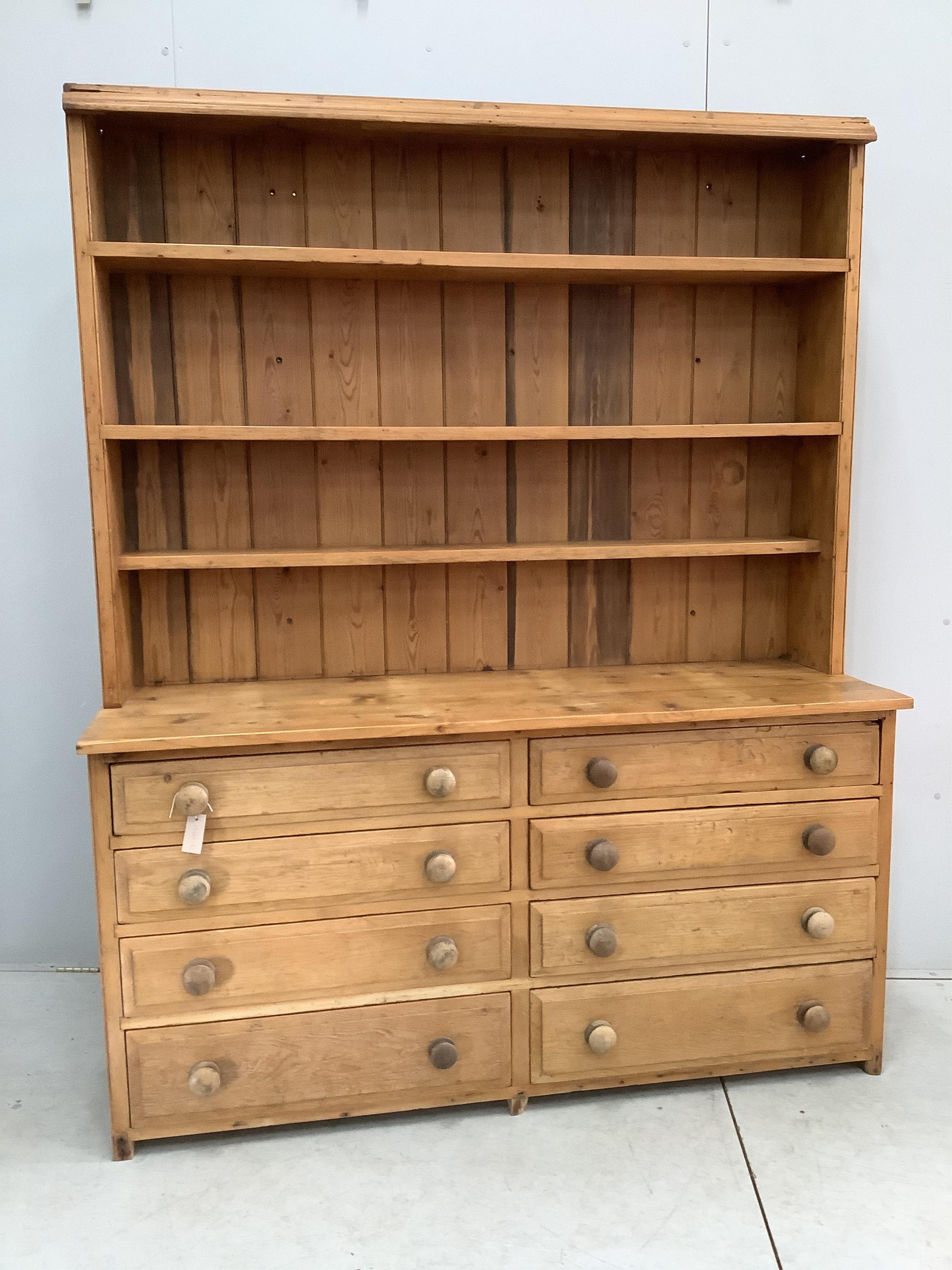 A Victorian style pine eight drawer dresser with boarded rack, width 157cm, depth 50cm, height 197cm. Condition - fair
